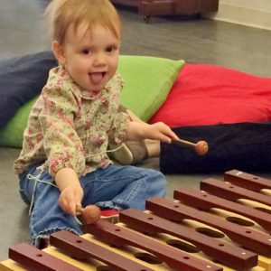 toddler playing marimba