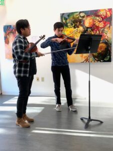 Kevin Jang teaches a violin lesson